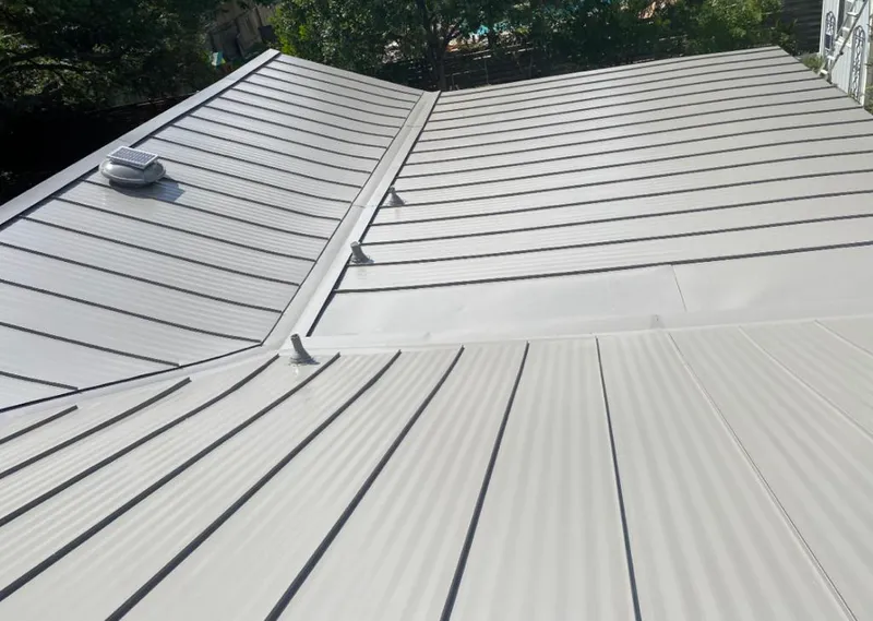Solar attic fan installed on a metal roof for Roof Ventilation in Coronado
